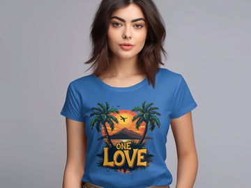A person wears a Garment Graphics blue T-shirt with ONE LOVE printed, featuring two palm trees and a bird against a Tropical Sunset. The backdrop is a simple gray gradient, reflecting the serenity of an ideal beach outing.