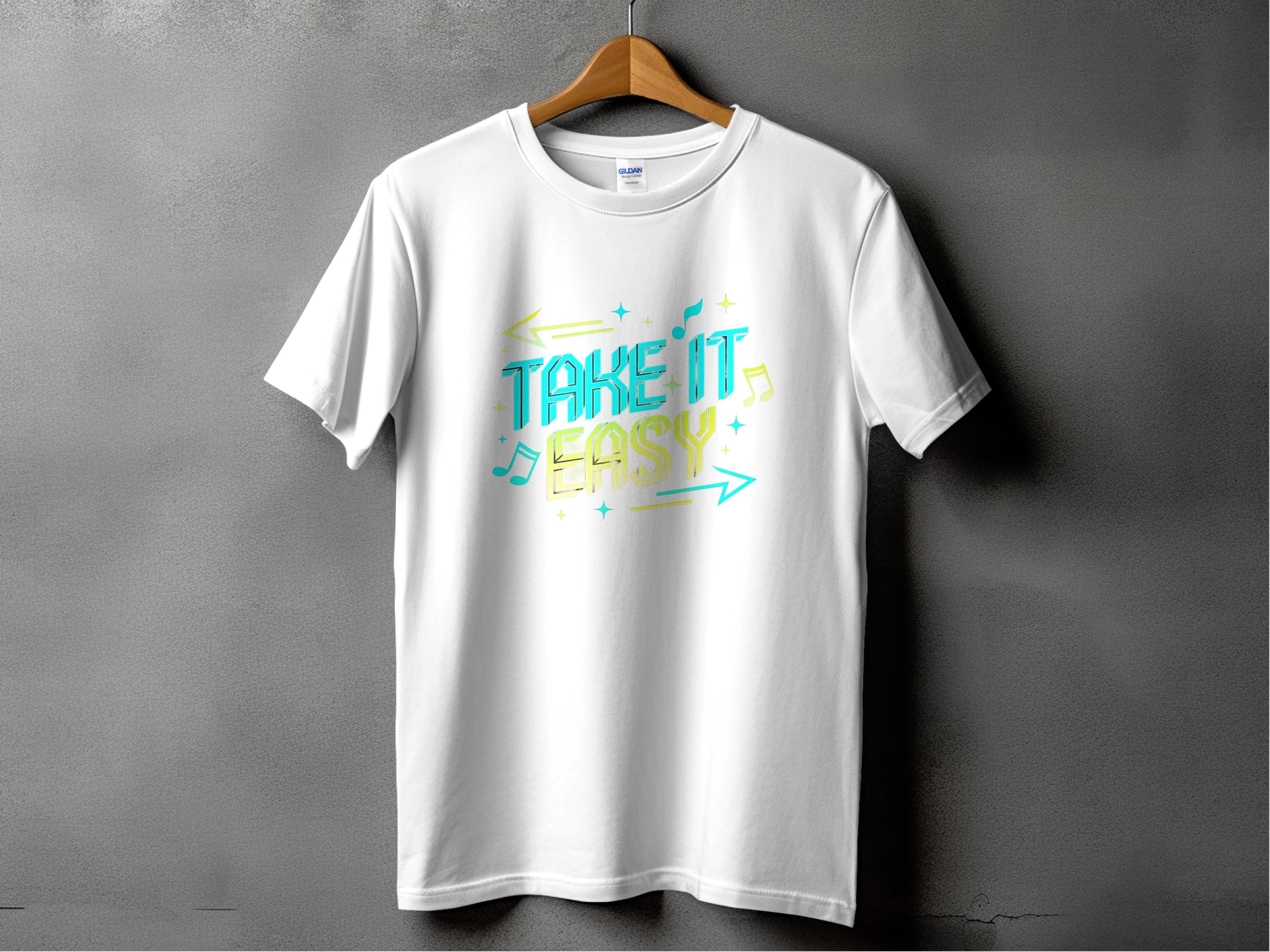 Against a gray backdrop, Garment Graphics presents a white T-shirt with vibrant blue and yellow Take It Easy text, surrounded by musical notes and arrows – perfect for unique style lovers.