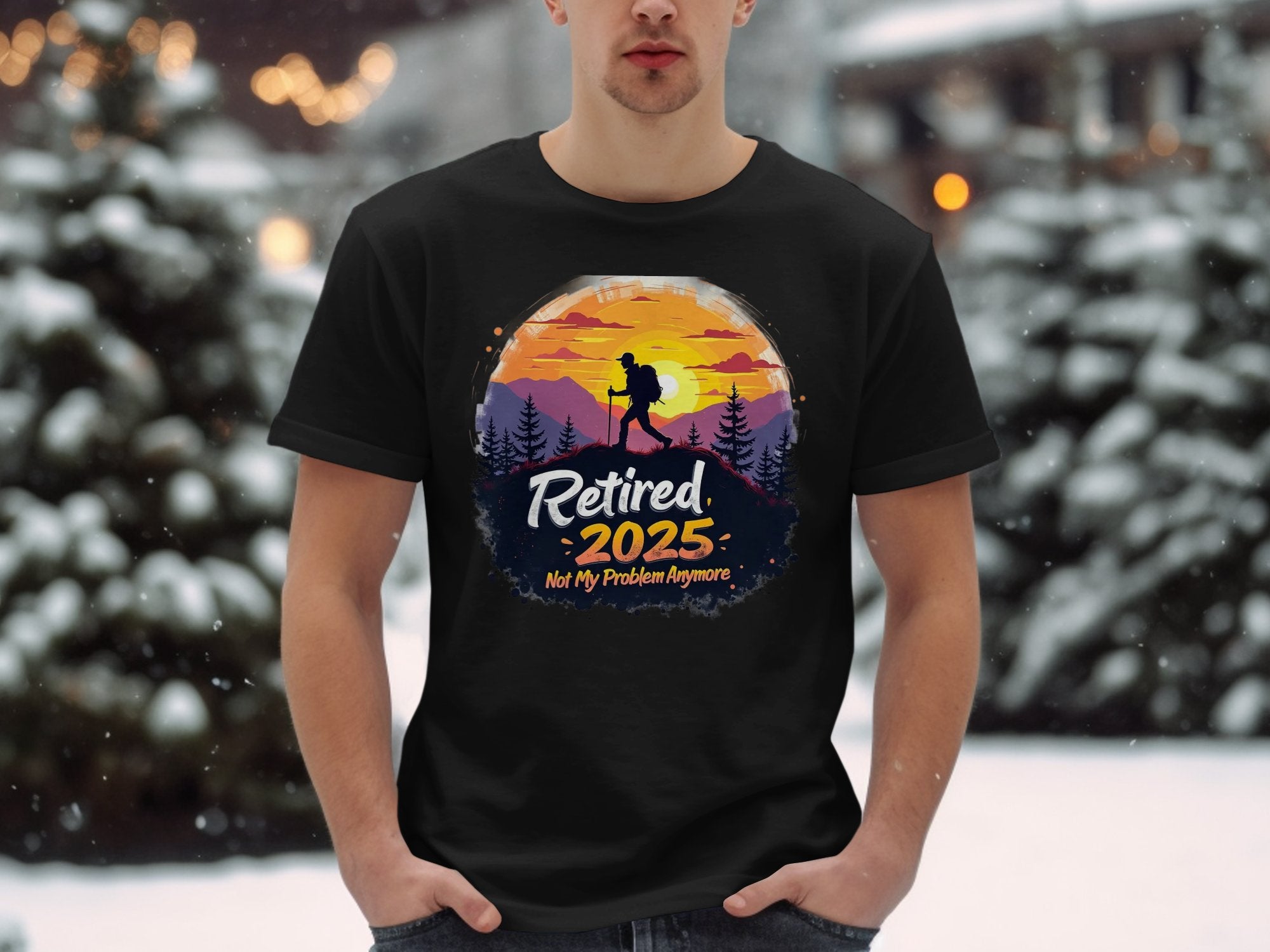 Sporting a Garment Graphics black t-shirt, a vibrant hiker graphic and Retired 2025 - Not My Problem Anymore text shine against a sunset with snow-covered trees, creating the perfect retirement scene.