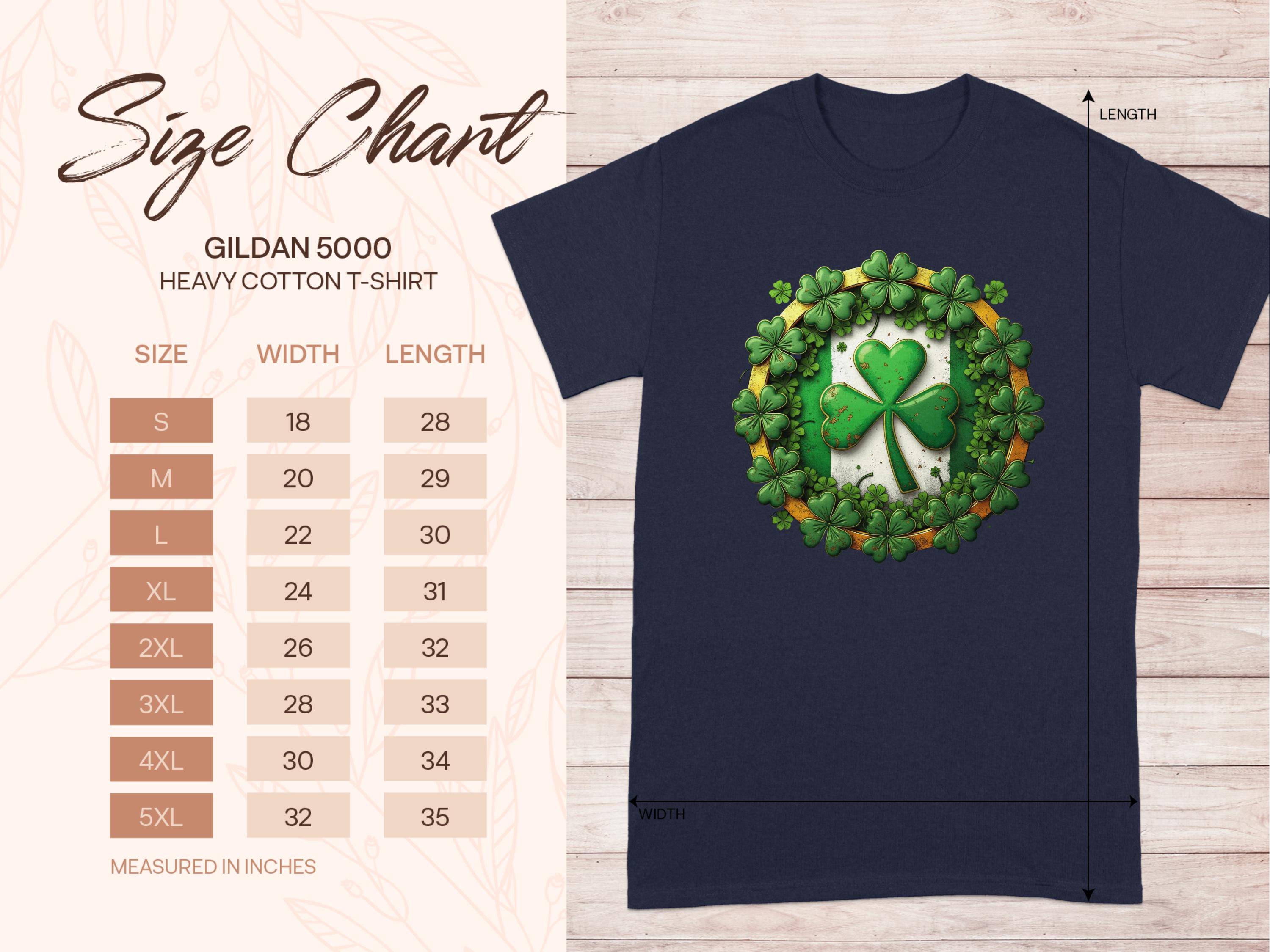 The Garment Graphics navy blue T-shirt features a shamrock clover within a wreath, ideal for St. Patricks Day. Its displayed on a wooden surface with a size chart for the Gildan 5000 heavy cotton tee showing sizes S to 5XL, including width and length in inches.