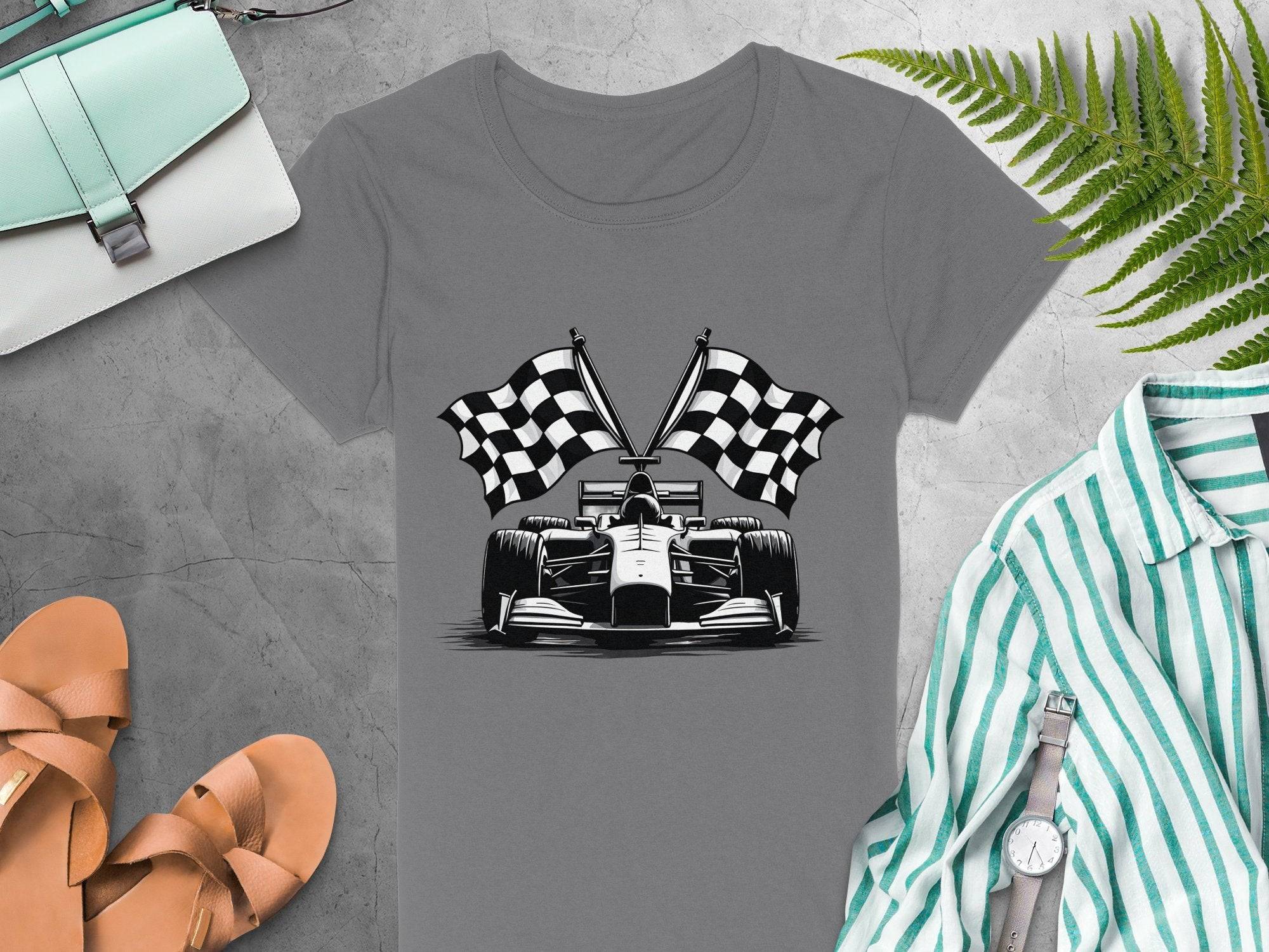 A Garment Graphics gray T-shirt featuring a racing car and checkered flags is paired with tan sandals, a striped shirt, a wristwatch, and a light blue purse. Ideal for motorsport fans, the ensemble is complete with a fern leaf in the upper right corner.