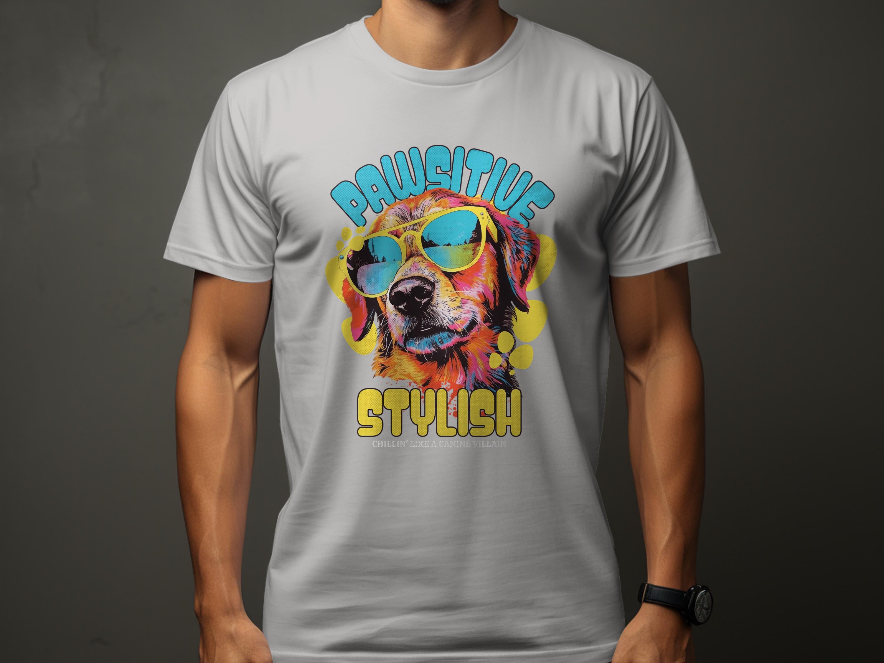 Someone wears a Garment Graphics gray T-shirt with a colorful print of a sunglasses-wearing dog. Chillin Like A Canine Villain in vibrant font adds flair, making this a paw-sitive stylish choice against the dark background.