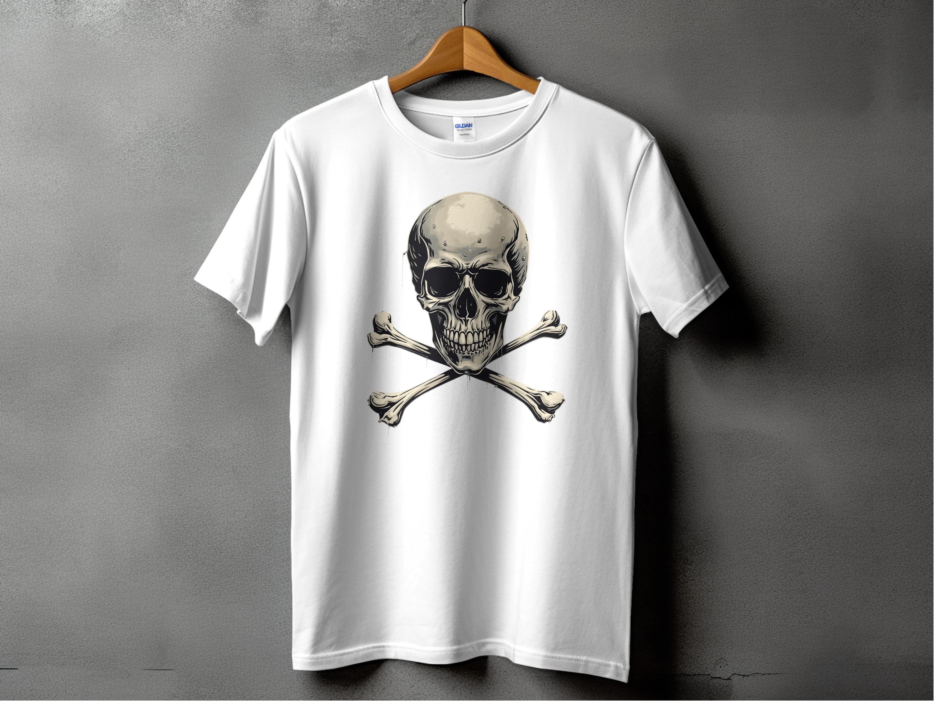A white Garment Graphics T-shirt on a wooden hanger set against a gray background features a striking skull and crossbones design, perfect for bold graphic T-shirt enthusiasts.