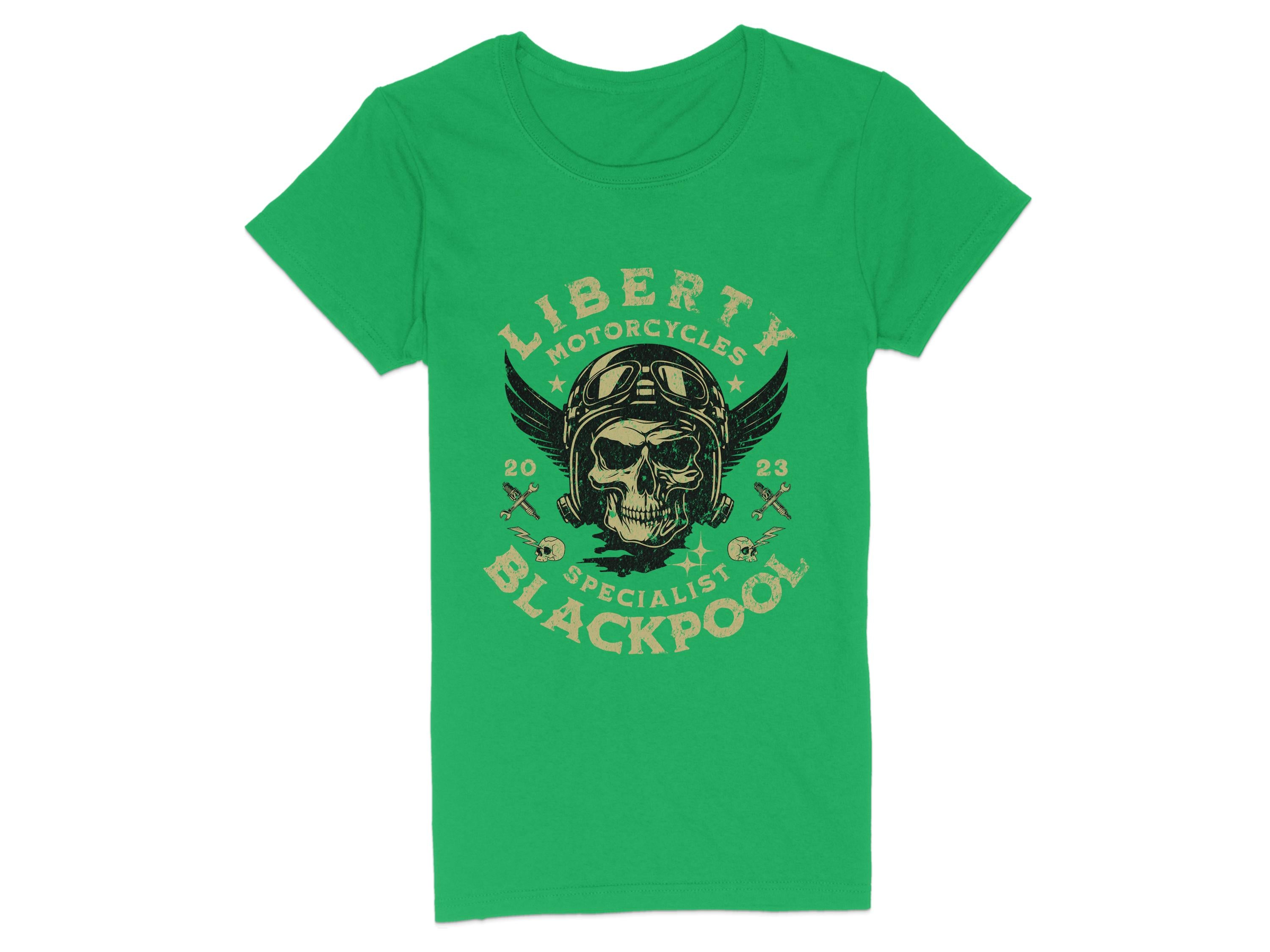Garment Graphics offers a green T-shirt with a Blackpool-themed design featuring Liberty Motorcycles Specialist Blackpool 2023 around a bold skull and wings graphic complete with aviator goggles.