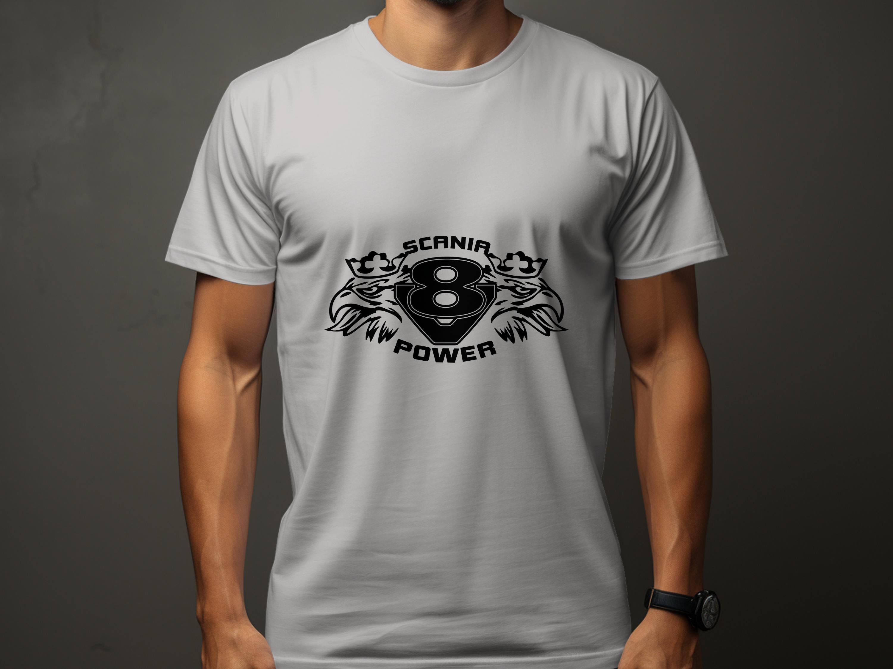 The individual wears a Garment Graphics plain white T-shirt with a bold graphic design showcasing the Scania V8 Power logo, featuring two stylized lions, a crown, and an intricate Scania Power Eagle motif.