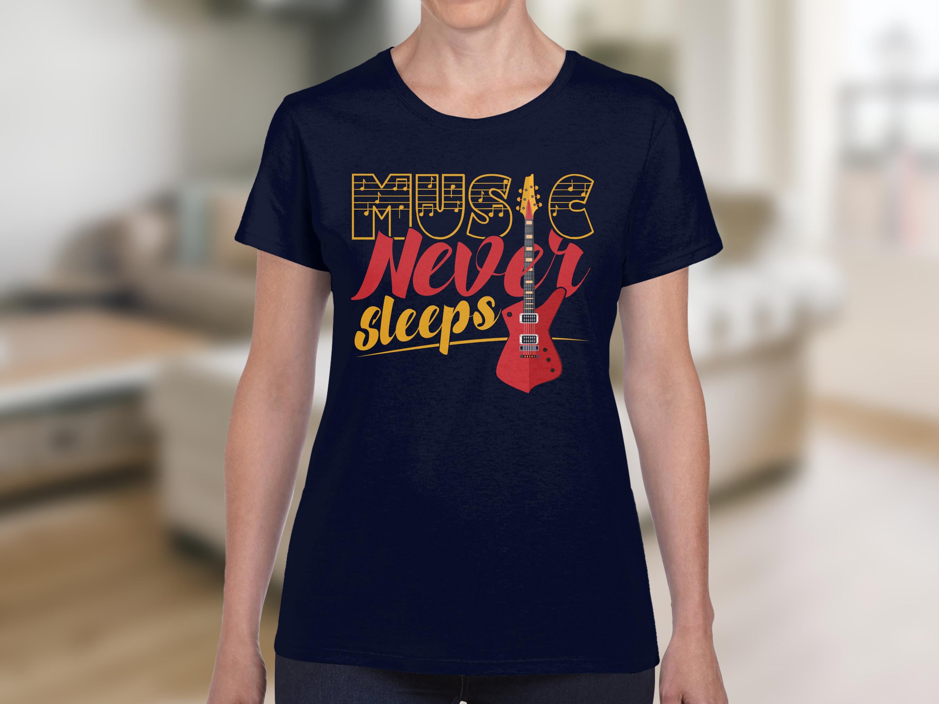 A person sports a Garment Graphics navy blue tee featuring Music Never Sleeps in bold yellow and red, adorned with a red electric guitar design. The scene is set against a softly blurred indoor background.