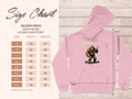 The Garment Graphics pink hoodie showcases a character in a red outfit with ADMIT IT text. Accompanying it, the size chart for the classic fit Gildan 18500 provides measurements in inches for sizes S to 5XL, detailing width and length.