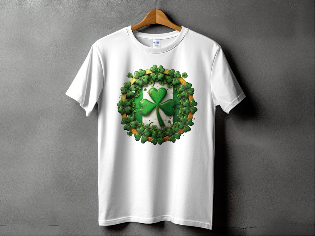 A Garment Graphics white graphic T-shirt hangs against a gray background, displaying a green shamrock clover encircled by smaller clovers—ideal for stylishly celebrating St. Patricks Day.