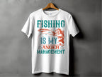 A white fishing T-shirt from Garment Graphics hangs on a wooden hanger against a gray background, featuring the bold design Fishing Is My Anger Management with teal and orange fish and lure images, ideal for any fishing enthusiast.