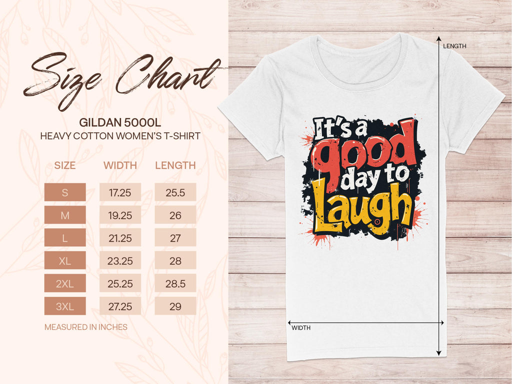 A size chart for the Garment Graphics 5000L Heavy Cotton Womens T-Shirt is shown beside a white graphic print tee stating Its a good day to Laugh. This semi-fitted, positive message shirt comes in Small to 3XL, with dimensions provided in inches.