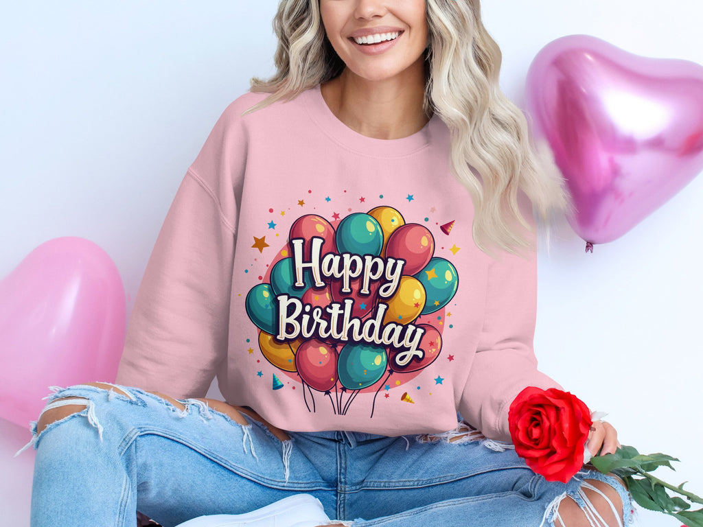 Dressed in ripped jeans and a pink Happy Birthday sweatshirt by Garment Graphics, they hold a red rose surrounded by colorful heart balloons. Perfect for any celebration, the unisex sizing ensures everyone can join the fun.