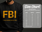 A person wears a black Garment Graphics sweatshirt adorned with yellow FBI Female Boob Inspector text. Next to them is a size chart for the unisex Gildan 18000 sweatshirt, offering sizes S to 5XL with detailed width and length measurements in inches.