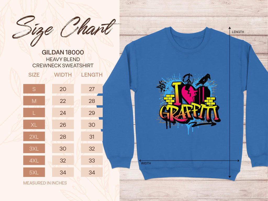 Garment Graphics presents a blue Gildan 18000 Heavy Blend Crewneck featuring vibrant I Love Graffiti text. Available in sizes S to 5XL, with dimensions in inches listed on the left. A subtle leaf pattern enhances its street art vibe.