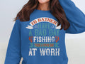 A person sports a blue Bad Day Fishing Sweatshirt from Garment Graphics, boldly stating, Id rather have a bad day fishing than a good day at work, capturing the essence of Fishing Passion Apparel.