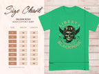 Garment Graphics green T-shirt boasts a vintage skull design with a helmet and goggles, featuring Liberty Motorcycles Specialist Blackpool and 2023. Ideal for motorcycle fans, it includes a size chart from S to 5XL.