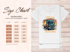 White Garment Graphics Gildan 5000L heavy cotton womens T-shirt with a truck graphic and Keep On Trucking slogan, ideal for trucking fans. Sizing chart on the left offers measurements from S to 3XL in inches. Displayed on a wood-texture background.