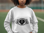 A person outdoors dons a stylish white sweatshirt from Garment Graphics with SCANIA POWER, two stylized animals, and the number eight printed on it. The blurred sports field background enhances the allure of this Scania Power V8 sweatshirt.