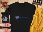 A black unisex sweater featuring the Scania logo, by Garment Graphics, is displayed on wood. It’s complemented by a yellow jacket, makeup items, sunglasses, pink shoes, a blue pouch, and a palette – an ideal ensemble for casual outings.