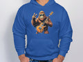 The Garment Graphics blue hoodie boasts a cartoon gorilla with sunglasses, rocking an orange electric guitar and a peace sign. Its the perfect choice for music and animal enthusiasts who will enjoy the Guitar Playing Gorilla design.