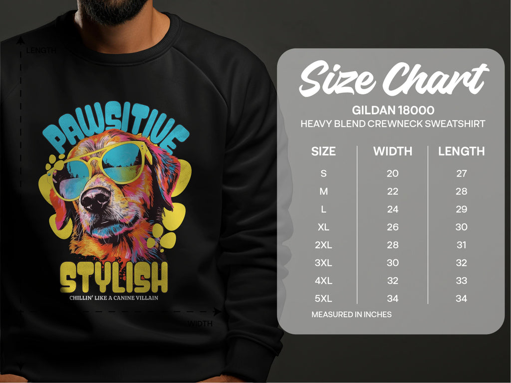 A person wears a black Garment Graphics sweatshirt with a vibrant dog graphic, perfect for dog lovers. The canine in sunglasses smiles beneath Pawsitive Stylish. A size chart for the Gildan 18000 sweatshirt offers measurements from S to 5XL.