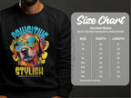 A person wears a black Garment Graphics sweatshirt with a vibrant dog graphic, perfect for dog lovers. The canine in sunglasses smiles beneath Pawsitive Stylish. A size chart for the Gildan 18000 sweatshirt offers measurements from S to 5XL.