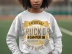 Wearing a humorous Garment Graphics sweatshirt, white with yellow and brown text: If hes got golf clubs in his truck or a camper in his driveway, I dont hire him, one adds charm and wit to the outdoor scene amidst a blurred backdrop.