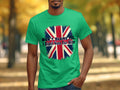 A person outdoors among trees with autumn leaves wears a classic-fit green T-shirt from Garment Graphics, showcasing the Union Jack and the bold statement Dont blame me, I didnt vote for him.