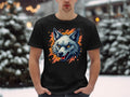 A person outdoors in a snowy setting wears a stylish Garment Graphics T-shirt, featuring a colorful wolf graphic with orange accents. Snow-covered trees and subtle lights complete the scene, showcasing fearless personality.