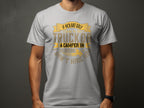 A person wears a light gray Garment Graphics T-shirt with a witty design saying: If hes got golf, a wife, a kid, a truck or camping humor in his driveway, don’t hire him, presented with playful fonts and embellishments.