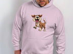 A person wears a light pink Garment Graphics hoodie featuring a cheerful animated brown and white cartoon puppy with an open mouth and wagging tail, perfect for dog lovers and capturing the lively spirit of canine companionship.