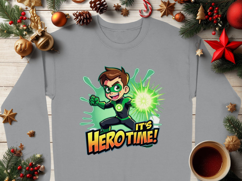A Garment Graphics gray long-sleeved shirt, featuring an adventure-loving youth in a vibrant Its Herotime graphic sweatshirt, is laid on a wooden table. Surrounded by festive decorations and a steaming cup of coffee, its colorful design exudes excitement and fun.