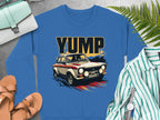 Garment Graphics features a blue sweatshirt with a YUMP rally car graphic and vibrant streaks, accompanied by a handbag, sandals, striped shirt, fern leaves, and a wristwatch on gray.