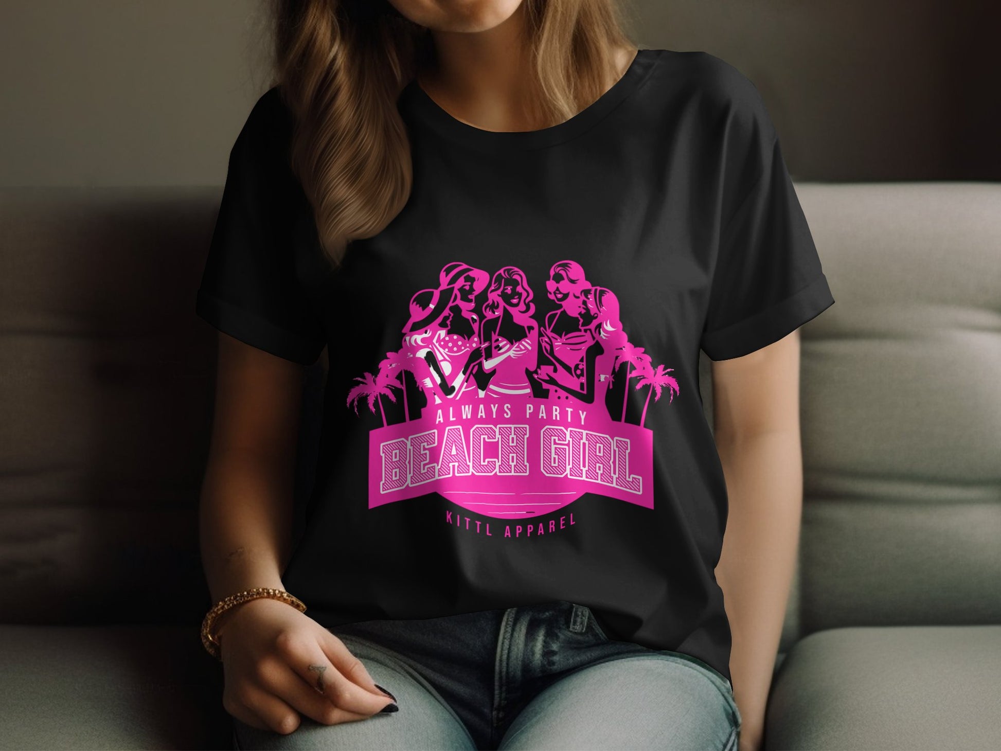 A person wears a black t-shirt with a pink graphic featuring three women with long hair and palm trees. Bold text reads Always Party Beach Girl Kittl Apparel, capturing the vibrant spirit of Beach Girl T-Shirts by Garment Graphics.