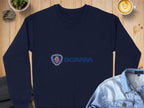 A navy blue sweatshirt from Garment Graphics featuring a griffin head Scania logo lies flat on a wooden surface. Unisex and perfect for casual outings, its surrounded by a denim jacket, a latte, a small potted plant, and a rock.