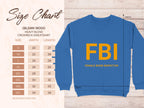 The Garment Graphics blue sweatshirt showcases FBI Female Boob Inspector in bold yellow print. It offers unisex sizes from S to 5XL, with width and length measurements in inches displayed on the left.