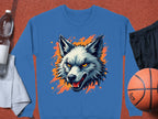A Garment Graphics blue graffiti-style sweatshirt showcases an illustrated wolf head with orange accents, set among a basketball, black shorts, a towel, and a water bottle on a textured orange surface.