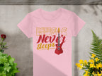 The Garment Graphics t-shirt showcases the vibrant Music Never Sleeps slogan in bold yellow and red with a striking red electric guitar. Its displayed on concrete, surrounded by lush green and yellow plants, capturing the essence of guitar t-shirts for music enthusiasts.