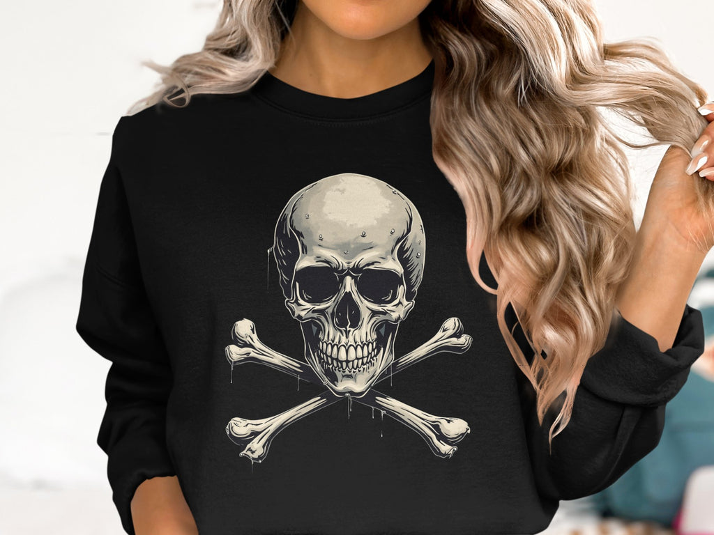 Someone with wavy, light brown hair sports an edgy look in a Garment Graphics black sweatshirt featuring a bold skull and crossbones design against a plain white background.