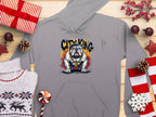 Garment Graphics presents a gray hoodie, ideal for casual wear, featuring a graphic bulldog with City King text. Displayed on wood with holiday décor like gifts and snowflakes, this Classic Fit piece combines style and comfort perfectly.