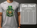 A person wears a gray Garment Graphics t-shirt featuring an Irish pride design with a bearded face in a green hat surrounded by shamrocks. Nearby, a size chart for Gildan 5000 heavy cotton t-shirts displays sizes from small to 5XL.