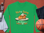 Garment Graphics presents a green Hot & Spicy sweatshirt featuring a playful pie character with eyes and a cheeky grin, asking, You Wanna a Piece of Me? This unisex piece is paired with essentials like a water bottle, towel, shorts, and basketball.