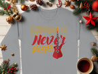 Garment Graphics offers a vibrant gray, long-sleeve guitar-themed sweatshirt featuring Music Never Sleeps and a red electric guitar graphic. Ideal for music lovers, it’s showcased amid Christmas decor like pine branches, ornaments, and a red star on a wooden surface.