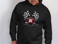 A man wears a Garment Graphics black hoodie featuring a striking red racing car and checkered flags on a plain white background, highlighting the bold designs passion for speed and competition.