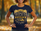 A person is wearing a quirky Garment Graphics navy blue T-shirt with gold lettering, If hes got golf clubs in his truck or a camper in his driveway, I dont hire him. This funny womens graphic tee features a backdrop of blurred autumn trees.