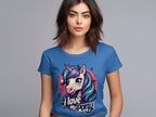 Against a plain gray backdrop, a unicorn enthusiast with long dark hair sports a Garment Graphics T-shirt featuring an I Love My Pony design with a vibrant unicorn graphic.