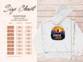 A size chart for the Garment Graphics Gildan 18500 heavy blend hooded sweatshirt is shown next to a white hoodie featuring a Retired 2025 sunset mountain design. Sizes range from S to 5XL, with measurements for width and length in inches.