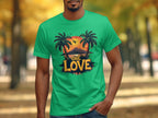 A person wearing a Garment Graphics green t-shirt with a tropical sunset, palm trees, a plane, and ONE LOVE strolls through an autumn park, captivating beach lovers.
