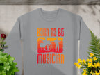 Garment Graphics gray sweatshirt, featuring Born to Be Musician text, depicts drummer and guitarist silhouettes on an orange-red background with green plants and yellow flowers. Perfect for music lovers, its available in unisex sizing.