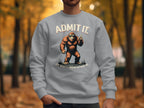 Amidst autumn foliage, a person showcases Garment Graphics Admit It sweatshirt featuring a Bigfoot graphic and witty Life would be boring without me text, effortlessly merging style and humor.