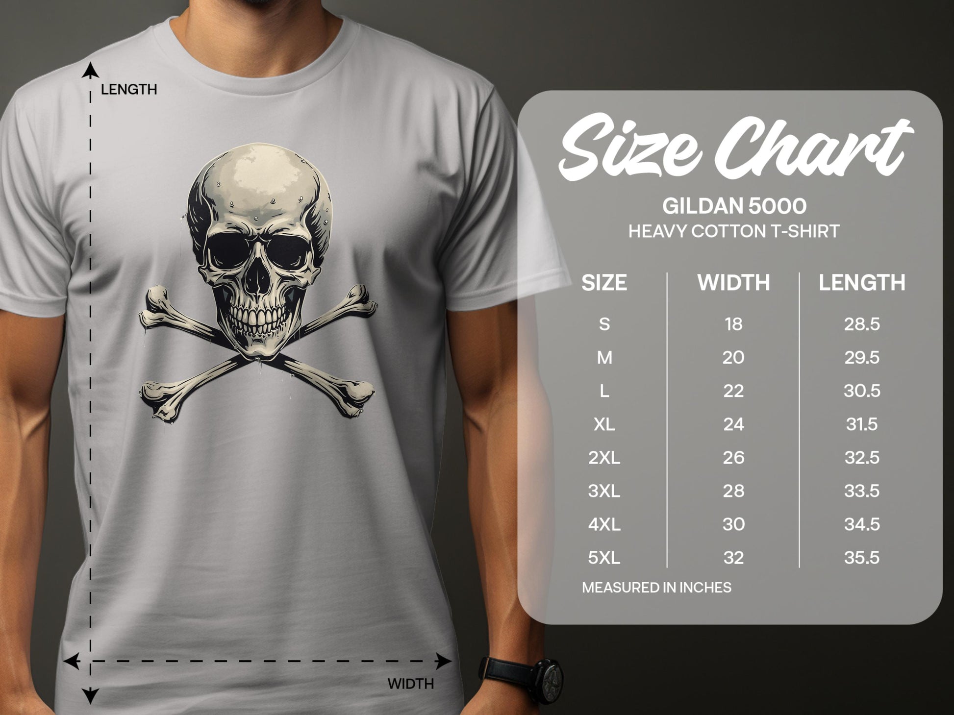 Wearing a trendy gray graphic T-shirt from Garment Graphics, the man flaunts a bold skull and crossbones design. Beside him, the size chart for Gildan 5000 heavy cotton lists sizes S to 5XL with corresponding width and length measurements in inches.